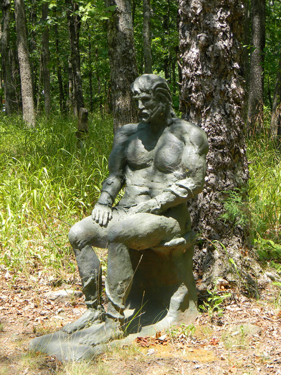 Green Man sculpture on meditation trail